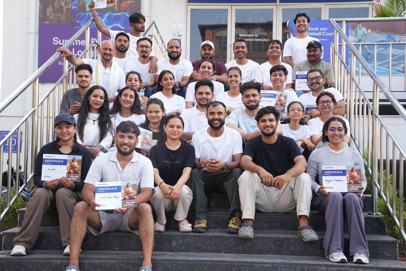 Full group photo with certificates — IYD 2026 Vedic Yog Kendra x Decathlon Dehradun